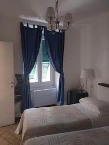 Кровать или кровати в номере La Gioia