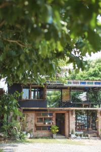 a house with a train on top of it at The Nanda Resort in Ban Huai Salok