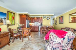 a living room with a couch and a table at SUGAR BEACH RESORT, #131 condo in Kihei +40 photos