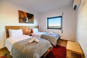 Postel nebo postele na pokoji v ubytování Casa do Beco - Seia, Serra da Estrela