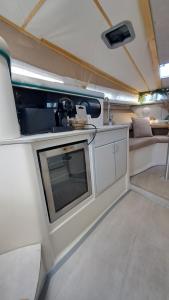 an interior of a kitchen in an rv at Beatrix boat in San Miguel de Abona