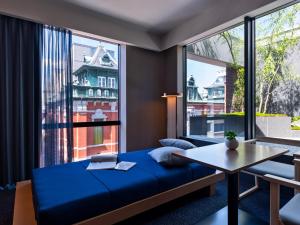 Mitsui Garden Hotel Kyoto Sanjo PREMIER客房内的一张或多张床位