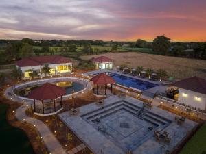 an aerial view of a swimming pool at dusk at Ranthambore Bagh Palace in Sawāi Mādhopur