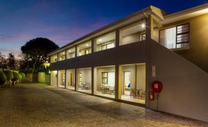 a large building with a lot of windows at Lalapanzi Guest Lodge in Gqeberha