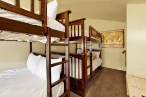 a bunk bed room with two bunk beds and a bunk bed at Buttercup Snow Summit Condo by Big Bear Vacations in Big Bear Lake
