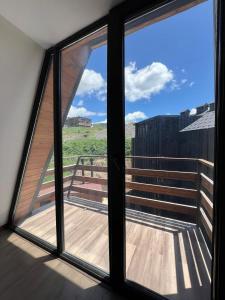 a view from a window of a balcony at Nirvana Stayz Gudauri in Gudauri