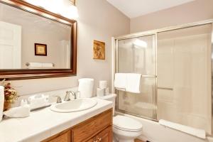 a bathroom with a sink and a toilet and a shower at Modern Luxury Retreat - Sacred Stone Big Bear in Big Bear Lake +24 photos