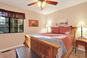 a bedroom with a bed and a ceiling fan at Modern Luxury Retreat - Sacred Stone Big Bear in Big Bear Lake