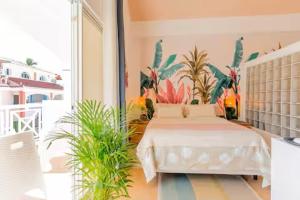 Postel nebo postele na pokoji v ubytování Tropical Groove Studio + 16 fotografií