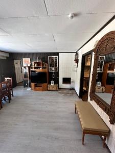 a room filled with furniture and a room with a couch at Cottage Viardo in Vehkataipale +40 photos