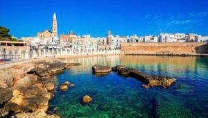 a large body of water with a city in the background at Sea Home 1 in Monopoli