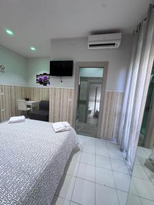 Postel nebo postele na pokoji v ubytování B&b La Ferrovia