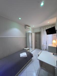 Postel nebo postele na pokoji v ubytování B&b La Ferrovia