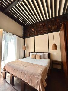 Postel nebo postele na pokoji v ubytování Alquimia Hotel Boutique