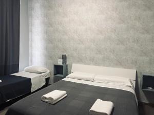Postel nebo postele na pokoji v ubytování Il Galileo Rooms + 20 fotografií