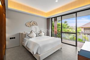Postel nebo postele na pokoji v ubytování Sewana Villa by Kozystay - Natadesa Resort + 70 fotografií