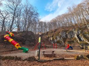 a park with a playground with a slide and a slidesktop at Ferienhaus am Berg in Hohenfels-Essingen