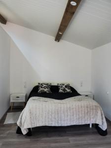 a bedroom with a bed in a white room at Casa da Ti Paqueta in Sabugal +16 photos