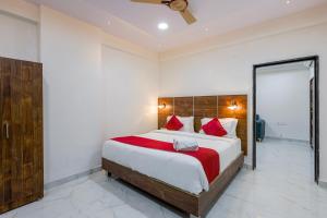 Postel nebo postele na pokoji v ubytování Hotel Advith Suites