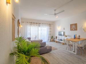 a living room with a couch and a table at Boho house, Albufeira in Albufeira