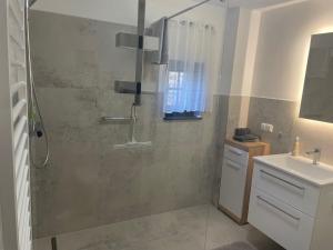 a bathroom with a shower and a sink at Schäferstr 43 in Peine +27 photos