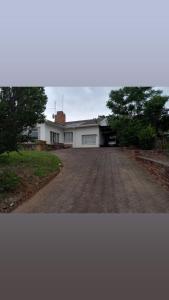 a house with a driveway in front of it at Vulindlela Mama Solutions in King Williams Town