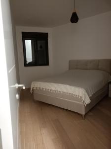 a bedroom with a bed and a window at Charlie in Trebinje +6 photos