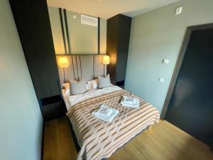 Postel nebo postele na pokoji v ubytování Gausta View Boutique Hostel