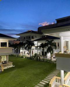 a large building with a lawn in front of it at BANS resort boracay in Boracay