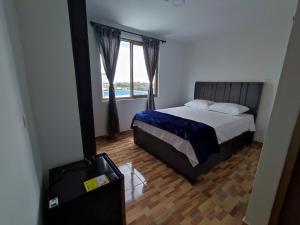 Postel nebo postele na pokoji v ubytování Apartahotel JDK