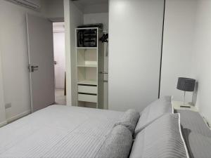 a bedroom with a bed and a walk in closet at Tigre High View Luxury views in Tigre