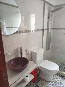 a bathroom with a sink and a toilet at Encanto de Lozano in Lozano