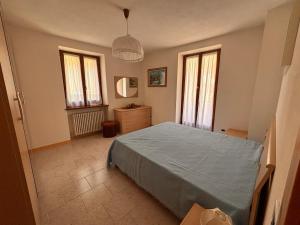 Ένα ή περισσότερα κρεβάτια σε δωμάτιο στο Casa Tonia - ampio quadrilocale