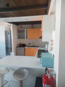 Η κουζίνα ή μικρή κουζίνα στο Residence sul mare all'interno del parco naturale con piscina