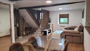 a living room with a glass table and a couch at Casa Verana en Asturias VV-3421-AS in Granda