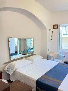 A bed or beds in a room at Camere Francesca