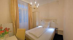 Postel nebo postele na pokoji v ubytování Hotel Fürst Bismarck
