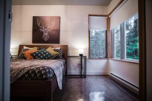 Ένα ή περισσότερα κρεβάτια σε δωμάτιο στο Welcome to La Cabine de Charlevoix