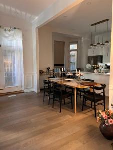 a kitchen and dining room with a table and chairs at Sweet Home in Toronto +40 photos