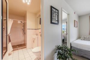 a bathroom with a shower and a toilet and a sink at Boutique Motel in Nelson +45 photos