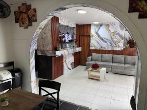 a living room with a couch and a fireplace at Hotel San Juan 70 Express Medellin in Medellín