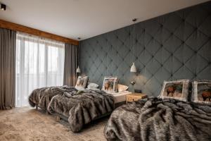 Posteľ alebo postele v izbe v ubytovaní Hotel Litworowy Staw