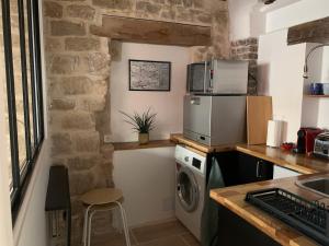 Η κουζίνα ή μικρή κουζίνα στο Charming studio +12 φωτογραφίες