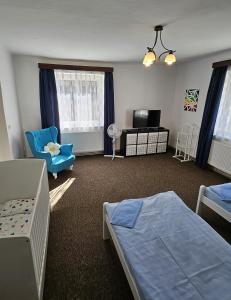 Postel nebo postele na pokoji v ubytování Rodinný apartmán U Kuby