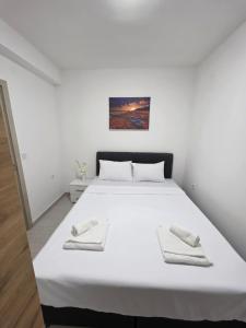 Postel nebo postele na pokoji v ubytování Taksim Aprartman