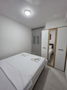 Postel nebo postele na pokoji v ubytování Taksim Aprartman