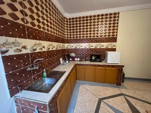 a kitchen with a sink and a counter top at Pokoj ZAKY 2 in Sidi Bibi
