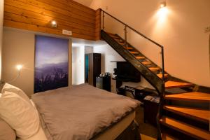 Postel nebo postele na pokoji v ubytování Auberge Sutton Brouerie