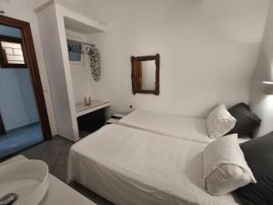 Postel nebo postele na pokoji v ubytování Maria Eleni Guesthouse