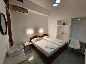 Postel nebo postele na pokoji v ubytování Maria Eleni Guesthouse